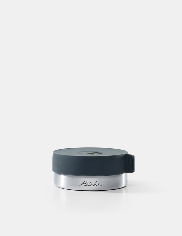 Matador Waterproof Travel Canister - 100ml - silver container with a black lid on a white background
