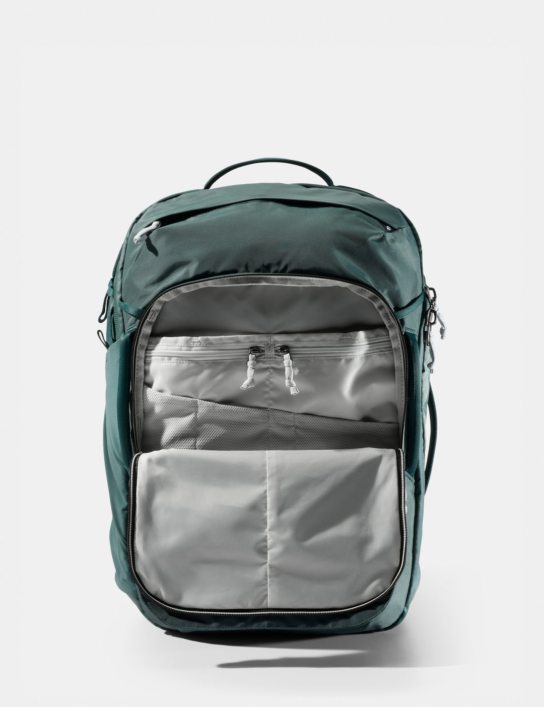 Matador 30L Carry-On Travel Pack in Juniper - green backpack with a gray interior on a white background