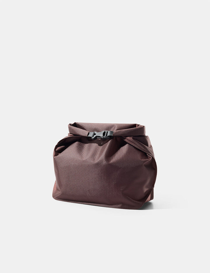 Matador FlatPak Waterproof Toiletry Case (V2) in Garnet - garnet toiletry bag with a buckle on a light gray background