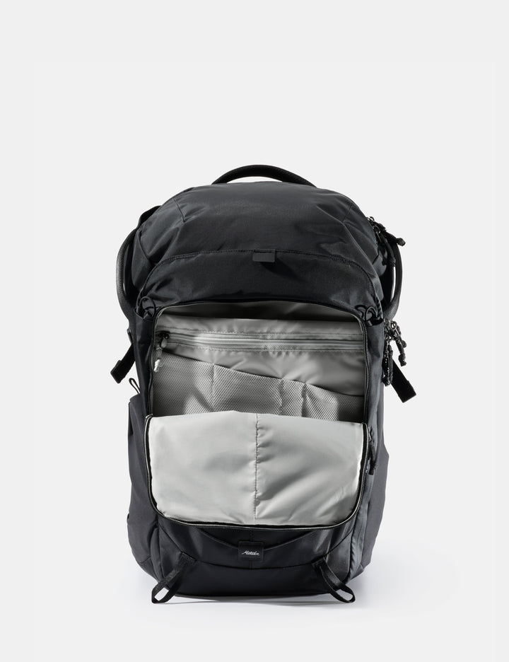 Matador 24L Adventure Pack in Black - black backpack with a gray compartment on a white background