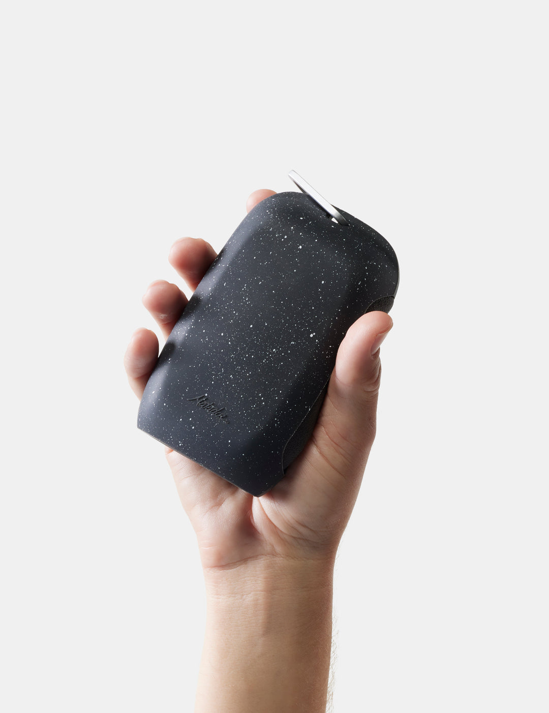 Matador NanoDry Towel - Large 132 x 60cm in Black Granite - hand holding nanodry towel case against a light gray background