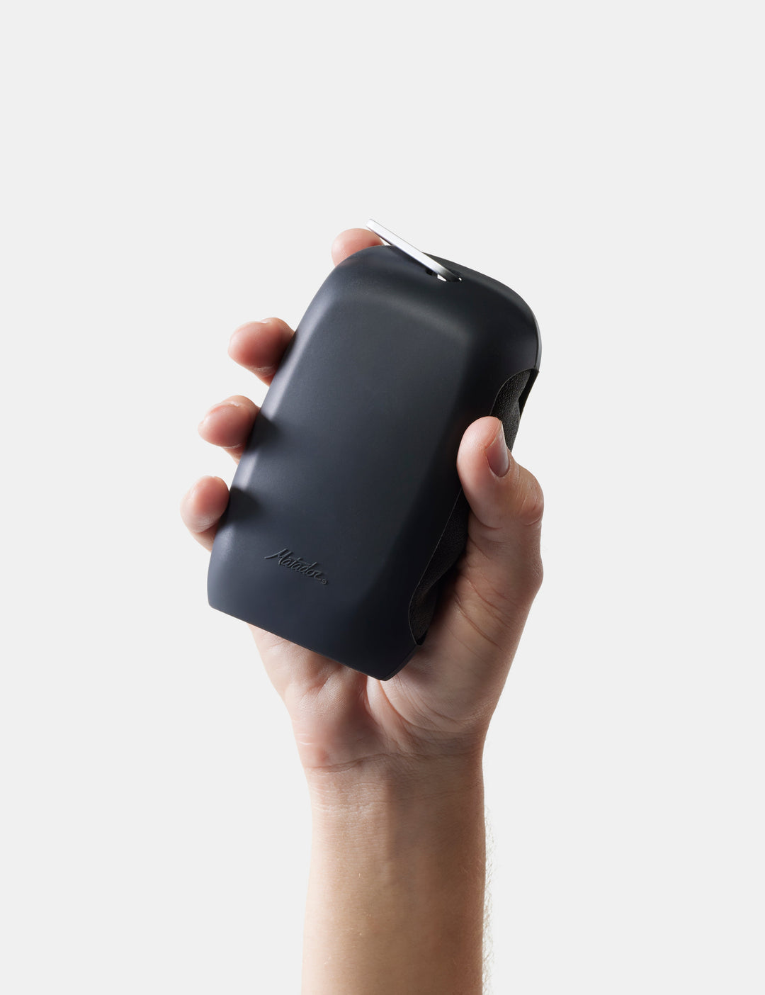 Matador NanoDry Towel - Large 132 x 60cm in Charcoal - hand holding a gray towel case against a light gray background