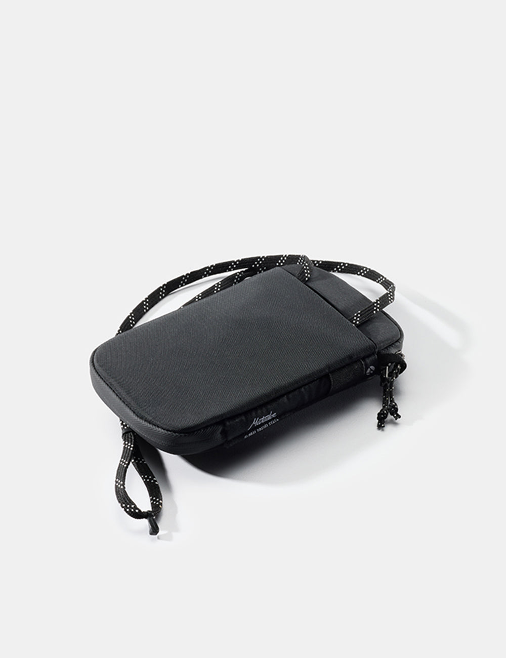 Matador Global Travel Stash in Black - back view of travel wallet with neck lanyard