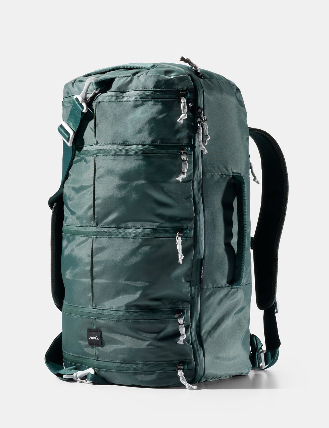Matador 45L SEG Hybrid Travel Pack in Juniper - green backpack with multiple zippers on a white background