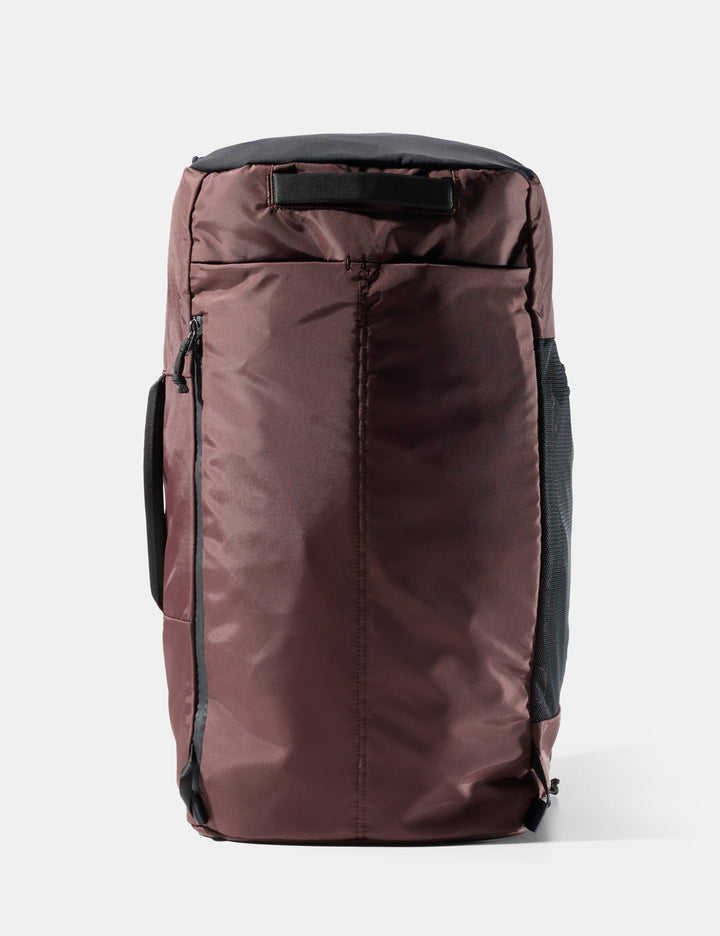 Matador 45L SEG Hybrid Travel Pack in Garnet - garnet backpack with black accents on a white background