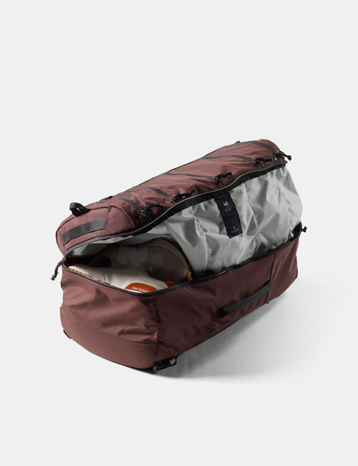 Matador 45L SEG Hybrid Travel Pack in Garnet - garnet duffel bag with open compartment on a white background