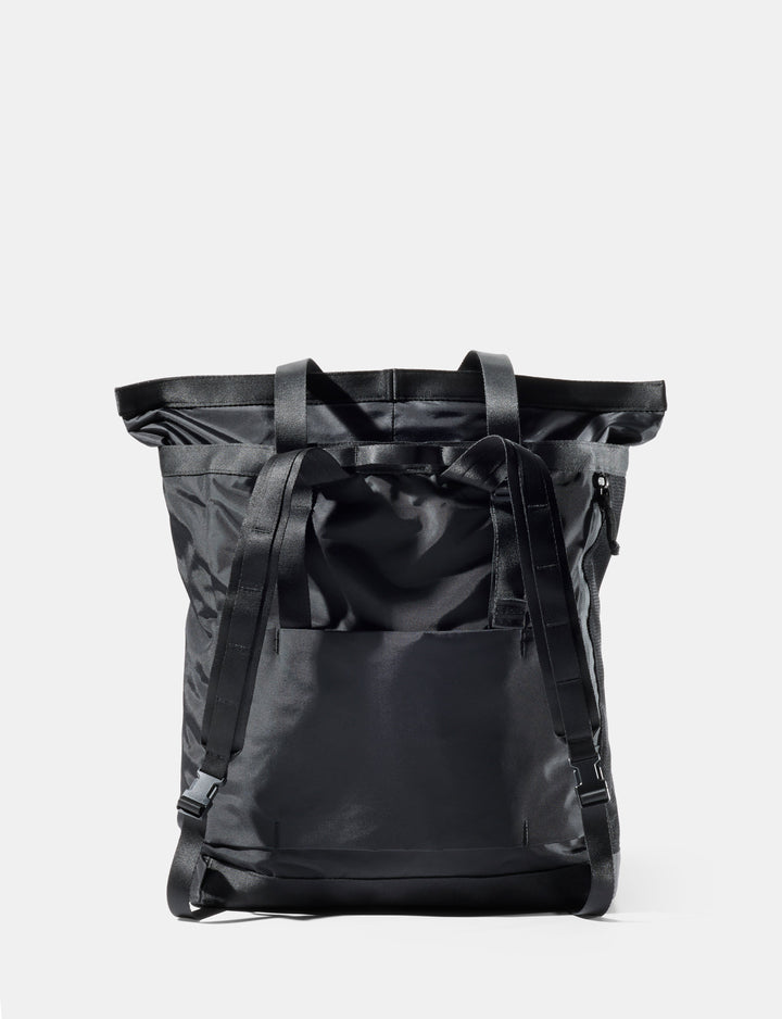Matador 24L Tote Pack in Black - black tote pack on a light gray background