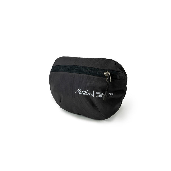 Matador On-Grid Packable Hip Pack folded to its 2L stuff pocket